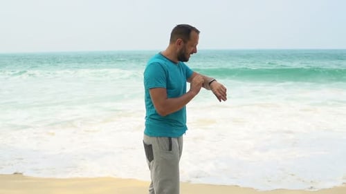 Man with Smartwatch Start Jogging on Beach, Super 240