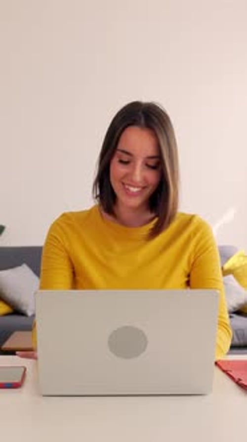 Excited Young Pretty Woman Receiving Unexpected Message on Laptop Computer