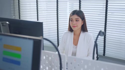 Asian beautiful businesswoman using laptop computer working in office.