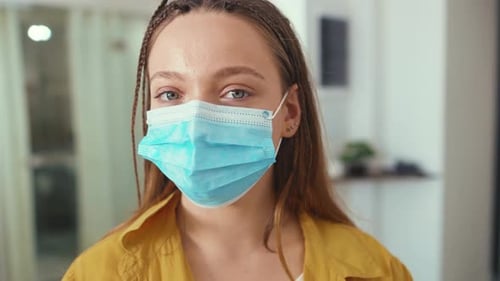 Young Adult Wearing Blue Protective Face Mask