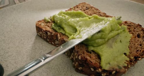 Spreading Avocado on Toast with Butter Knife
