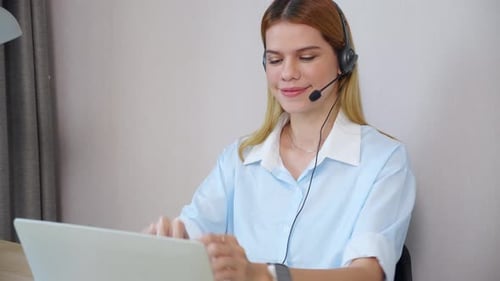 Professional young business woman working and meeting online in modern home office.