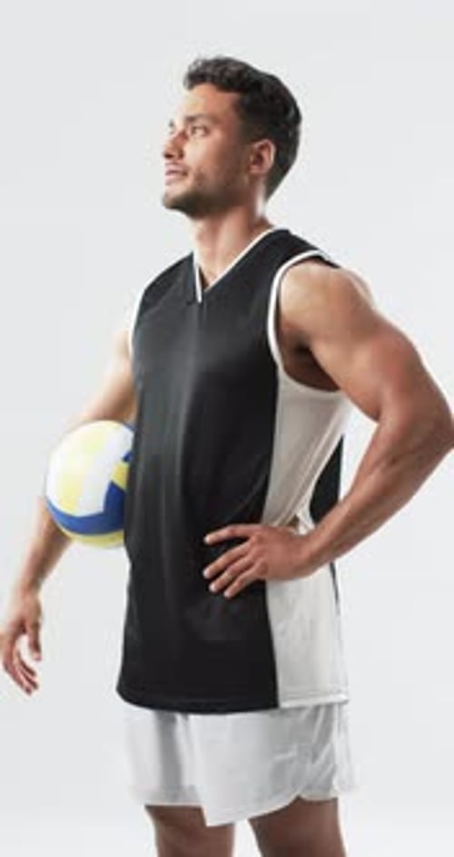 Man Holding a Volleyball