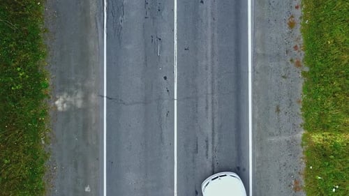 Aerial View of Convertible Car Driving Along Country Road in Forest of Georgia in Summer on Sunny