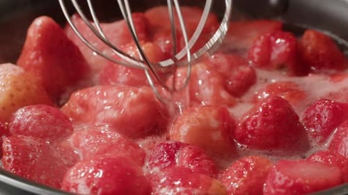 Fresh Strawberries Simmering to Make Jam or Sauce