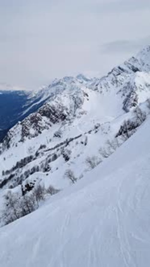 Aerial View of the Snowy Peaks of the Rocky Mountains Range Winter Snowy Natural Landscape