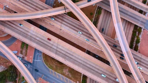 Descend over the multi-lane highways and trestles above them.