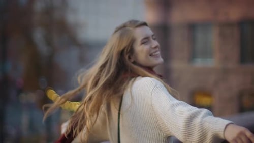 Closeup Excited Girl Dancing on City Street. Portrait of Cheerful Woman Whirling