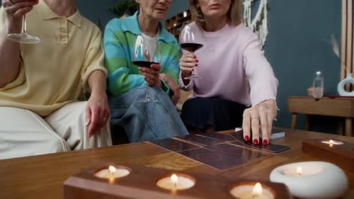 Middle-aged Women Having Fun Fortunetelling