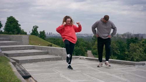 in the Park a Young Couple in Love Doing Sports Couples Warming Up Healthy Lifestyle Synchronized