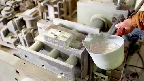 Molten Metal Pouring into a Metal Mold