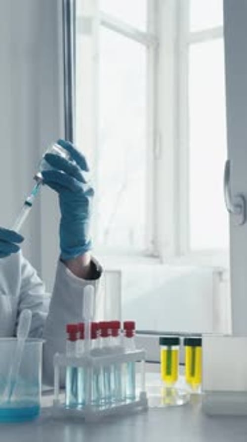 Woman Scientist Works with Syringe in Bright Laboratory