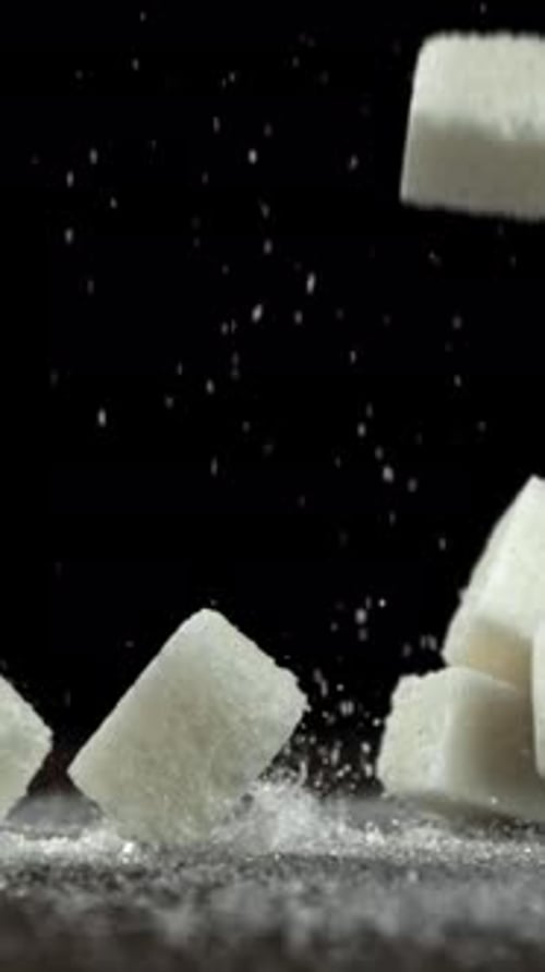 Sugar Cubes Fall on the Table Filmed on a Highspeed Camera at 1000 Fps