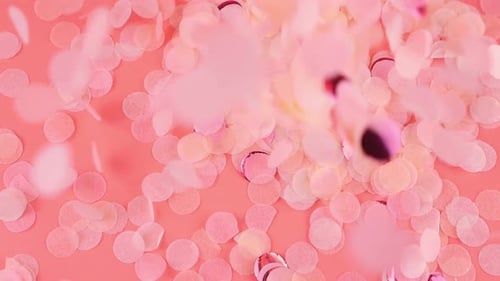 Pink and Iridescent Confetti Falling on Pink Background