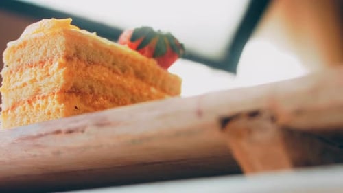 Close-Up Slice of Cake with Strawberry Topping