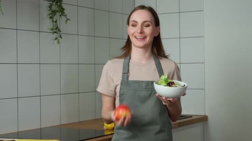 Smiling Woman Enjoys Healthy Salad and Apple Snack