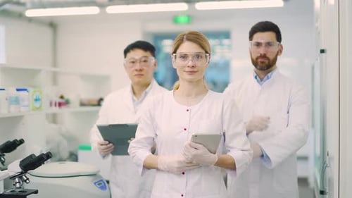 Scientists Standing Together in Modern Research Laboratory