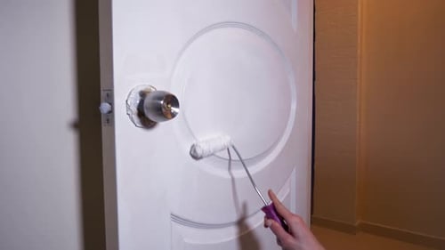 Man Paints Wooden Door White 2K