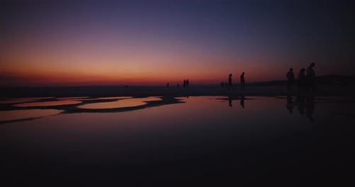 Serene Reflections and Silhouettes at Sunset on the Salt Lake Tuz in Turkey