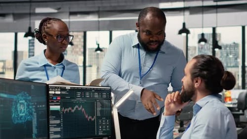 Teamworking Traders in Prop Firm Office Leverage AI Tech to Interpret Charts