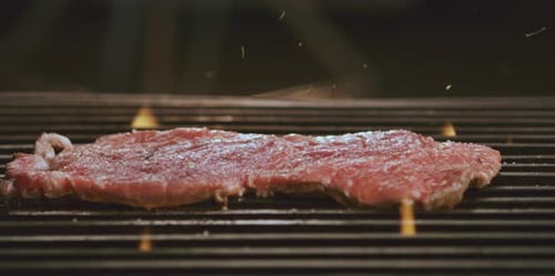Ingredients falling on steak piece