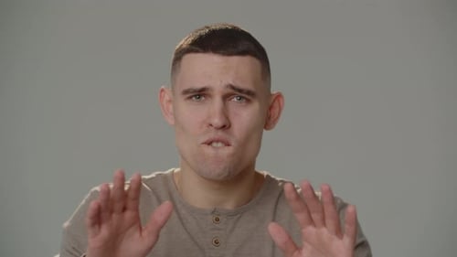 Man Expressing Emotions with Hand Gestures