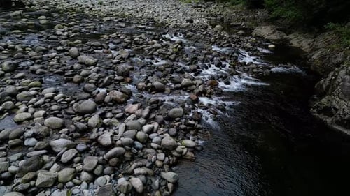 River in a Rocky Mountain Canyon British Columbia Canada Aerial Nature Background Cinematic