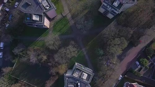 Aerial top down circle shot of three high rising apartment blocks in germany city during sunny day i