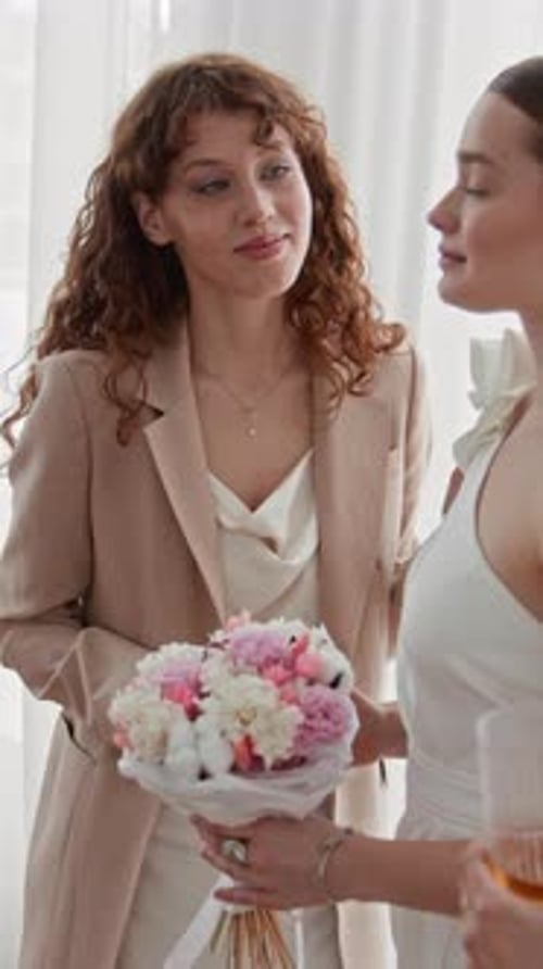Best Friend of Bride Adjusting Her Dress