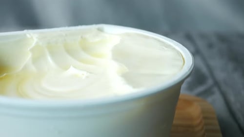 Close Up of Fresh Butter in a Container