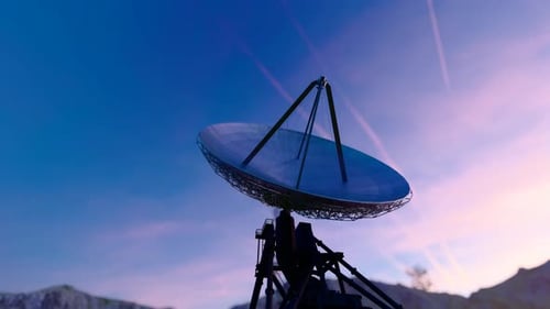 Satellite Dishes Silhouetted Against Golden Sunset Sky