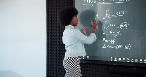 Teacher, black woman and writing on board for math or physics lecture in university