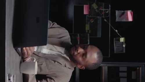 Bearded Man in Suit Working on Computer