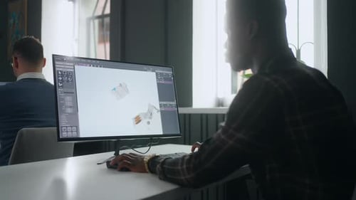 Project and Development Department African Man Creating 3D Model By CAD System