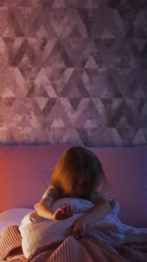 Nervous Little Girl Scratches Plaid on Bed Near Play Wigwam