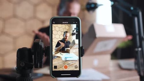 Man Opening Packages for Online Product Review