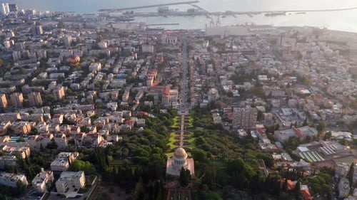 Hot air balloon above Haifa bay and Downtown area at sunrise, Aerial view