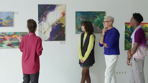 Gallery Guide Giving Tour to Visitors