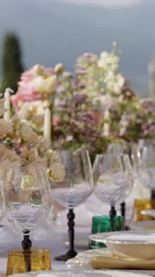 Elegant Wedding Table Decor with Flower Arrangement and Crystal