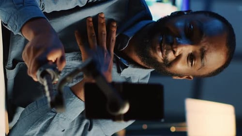 Smiling Man Vlogging in Vertical Format