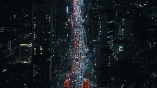 Tokyo Night Traffic Flow Through Skyscrapers