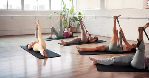 Pilates, people and stretching legs with resistance band for flexibility, healthy body or fitness