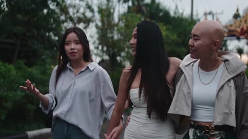 Three Diverse Asian Women Friends Walking Together Outside
