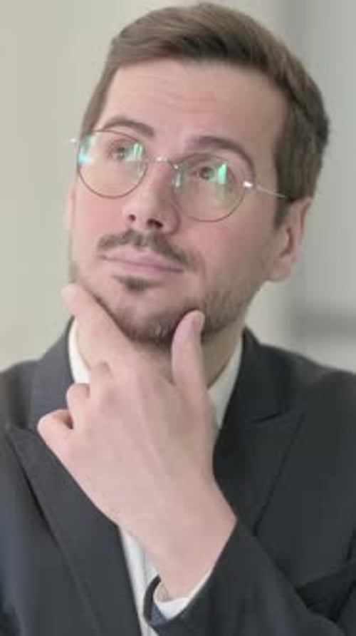 Portrait of Brainstorming Businessman Thinking New Plan, vertical video