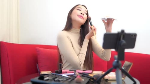 Woman Applying Makeup for Online Beauty Tutorial