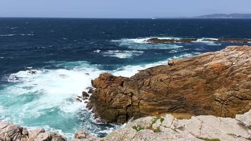 Atlantic Ocean Waves Crashing on the Rocky Coastline on a Windy Day