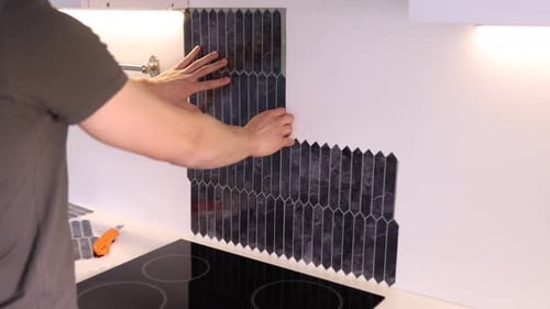 Installing Self-Adhesive Black Marble Tile in Kitchen