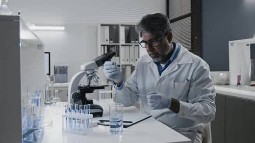 Scientist Conducting Experiment in Bright Laboratory