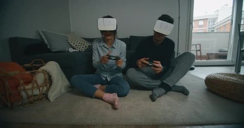 Couple Gaming with Virtual Reality Headsets at Home