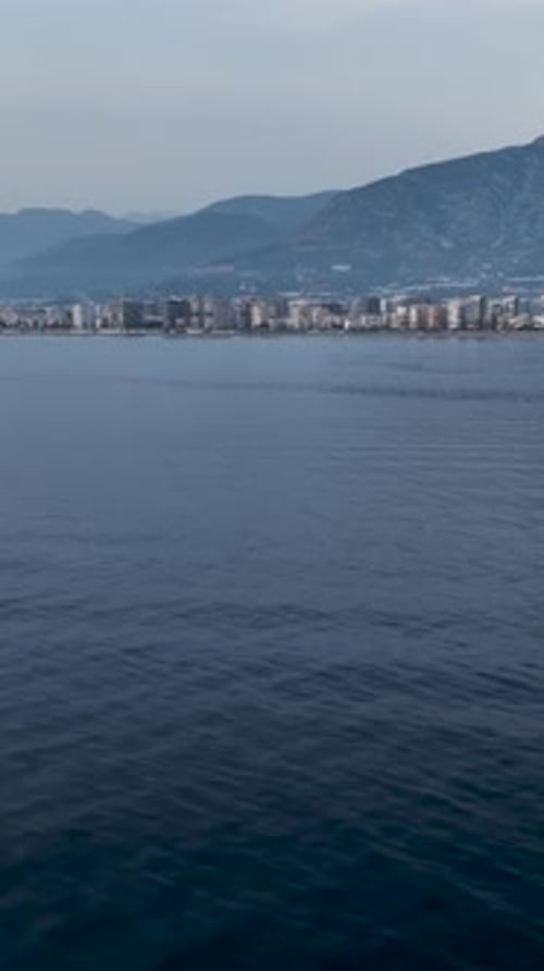 Vertical Video Cityscape Sunset Aerial View of Urban Panorama on the Horizon